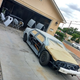Spraying the car with grey primer before the paint. Look how easily the body panels pop off!